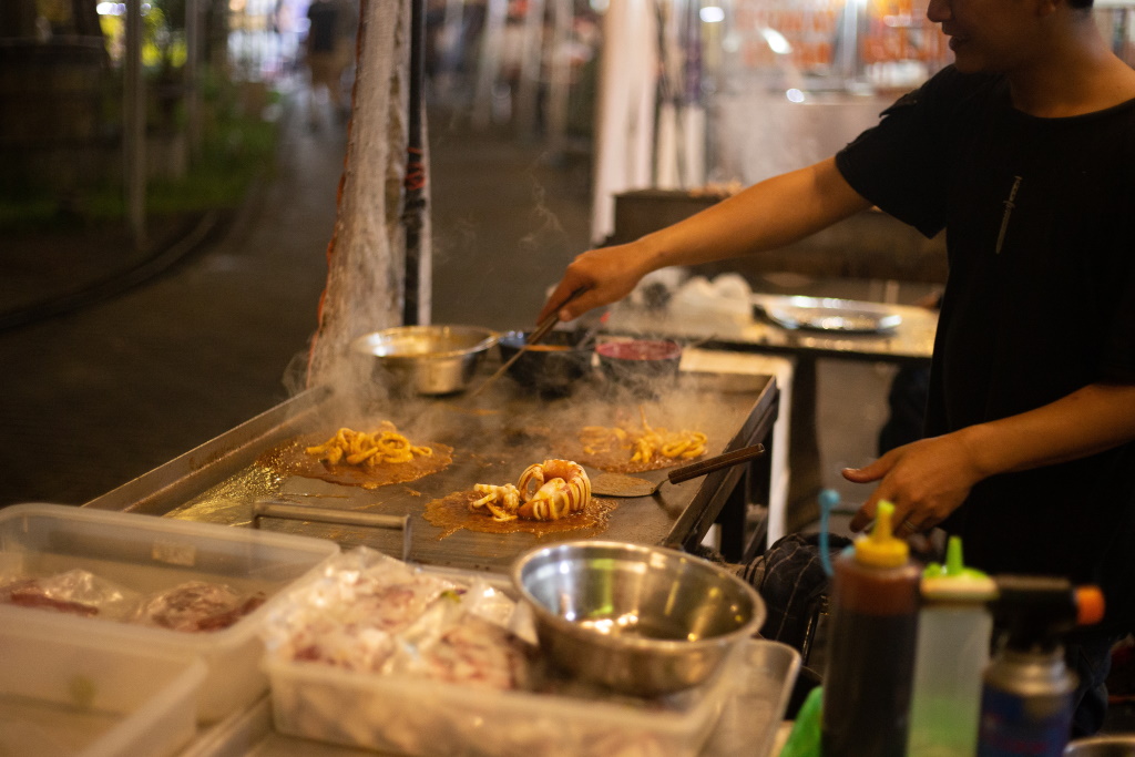 food sizzling on the hob